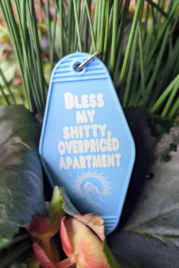 Bless this shitty, overpriced Apartment Motel Keychain